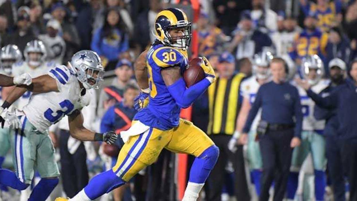 The Rams' Todd Gurley runs the ball against the Dallas Cowboys on Jan. 12, 2019, in an NFC divisional playoff football game at Los Angeles Memorial Coliseum.