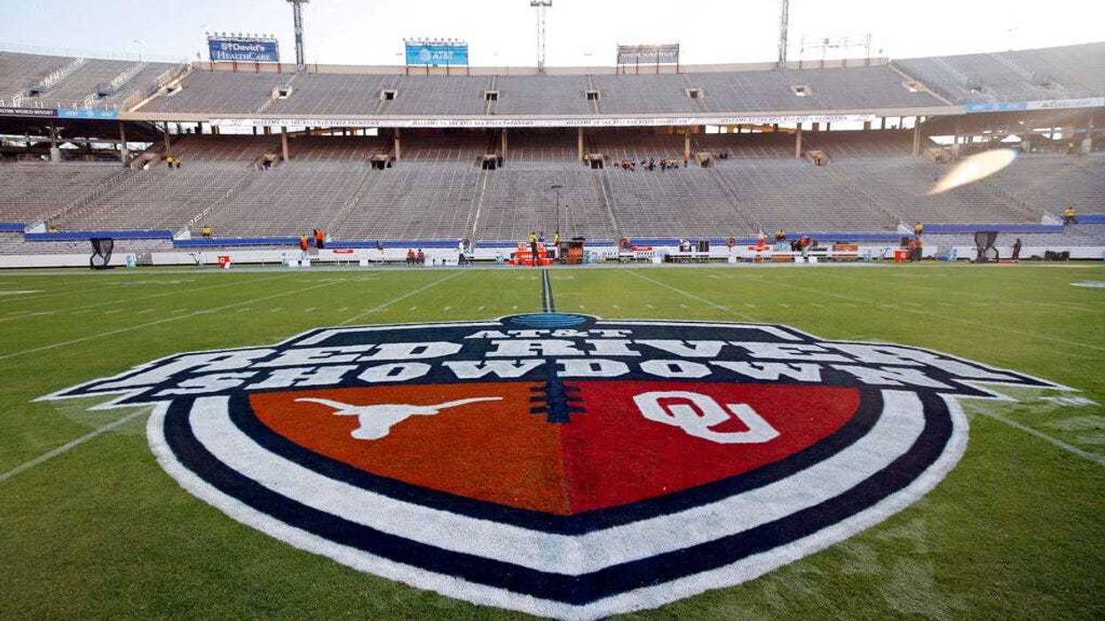 The Red River Showdown logo is displayed on the field of the Cotton Bowl