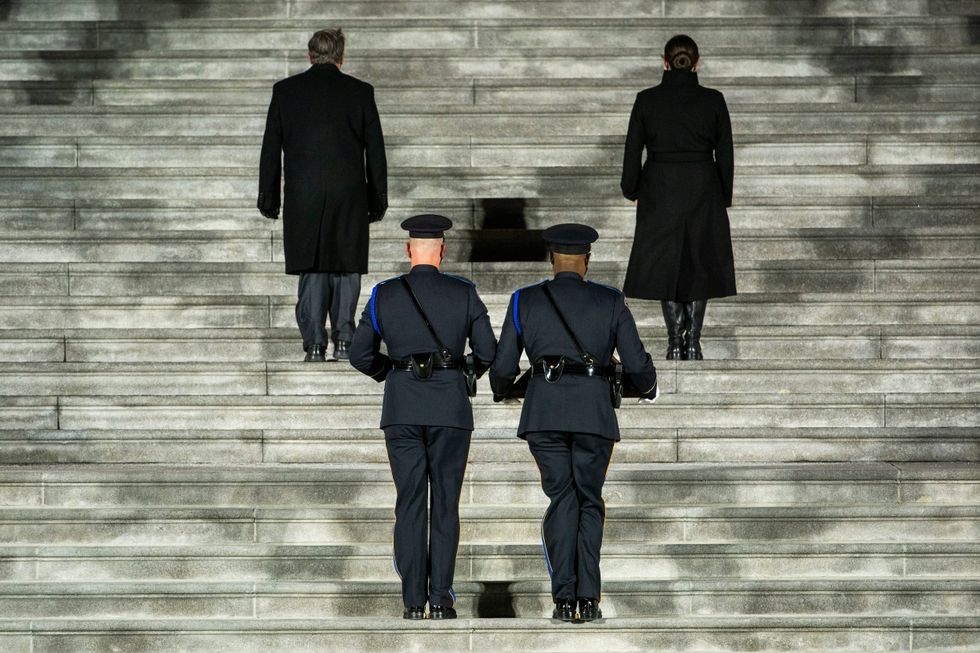 The remains of U.S. Capitol Police officer Brian D. Sicknick are carried up the East Front steps of the U.S Capitol to lie in honor in the Rotunda on February 2, 2021 in Washington, DC.