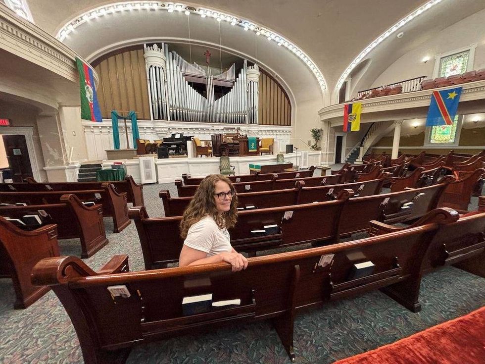 The Rev. Mindy Fugarino, senior pastor of Independence Boulevard Christian Church, sits inside the church