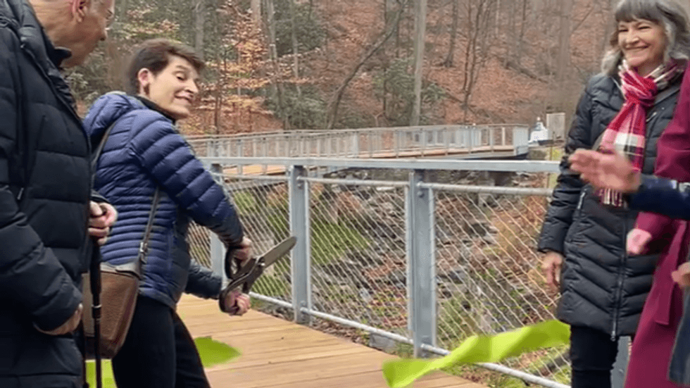 The ribbon is cut on Lida Way Bridge over the Valley Green Run streambank.