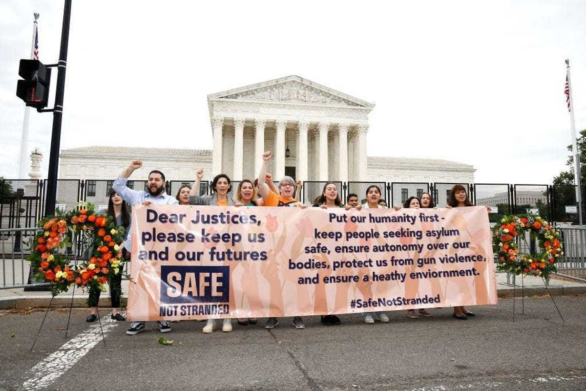 The Safe Not Stranded Coalition protest the "Remain in Mexico" policy" outside the US Supreme Court on June 22, 2022 in Washington, DC. (Photo by Paul Morigi/Getty Images for Safe Not Stranded Campaign)