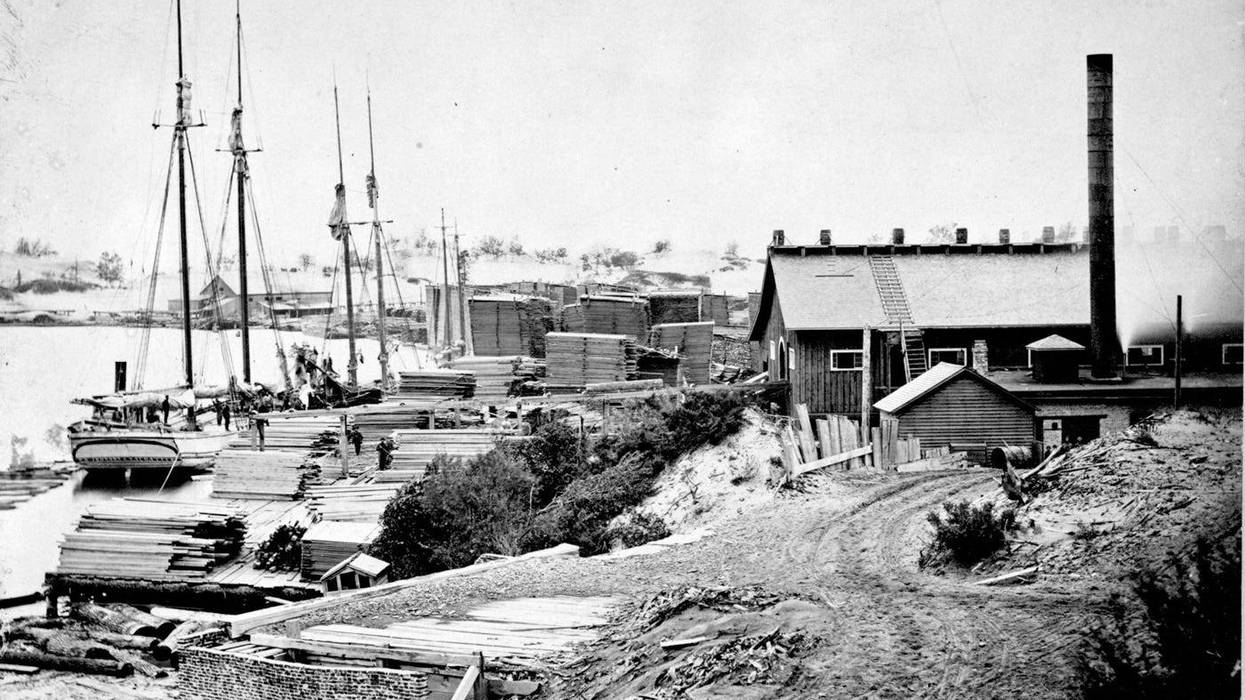 The saw mill and lumber yard in Singapore at the mouth of the Kalamazoo River, circa 1869.