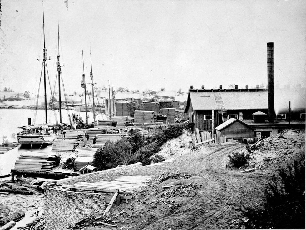The sawmill and lumberyard bustling with activity in 1969.