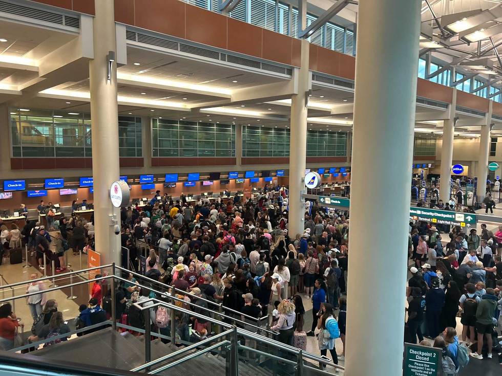 The scene Friday morning at MSP Airport with flight delays and cancellations leading to a chaotic scramble for travelers.
