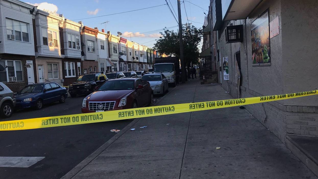 The scene near 7th and West Porter streets after an off-duty officer shot a man who lunged at him with a pair of scissors, according to police.