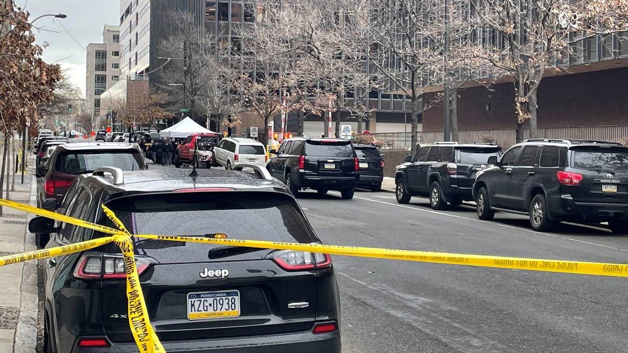 The scene where an armed man was shot by a security officer outside the federal courthouse in Center City Tuesday morning.