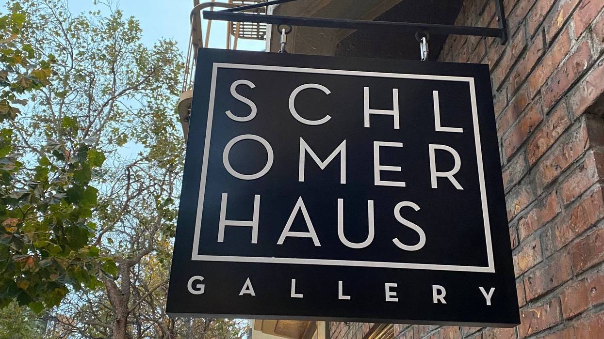 The Schlomer Haus Gallery sign at the entrance of the venue.