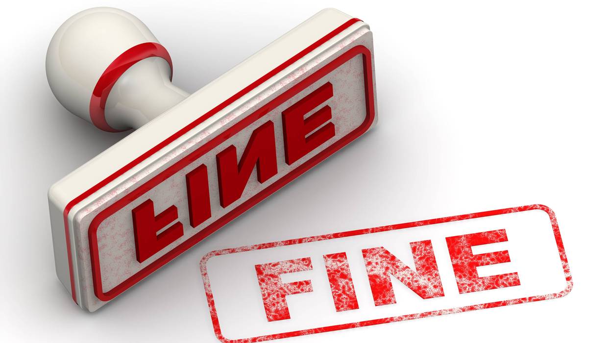 The seal with red imprint FINE on white surface