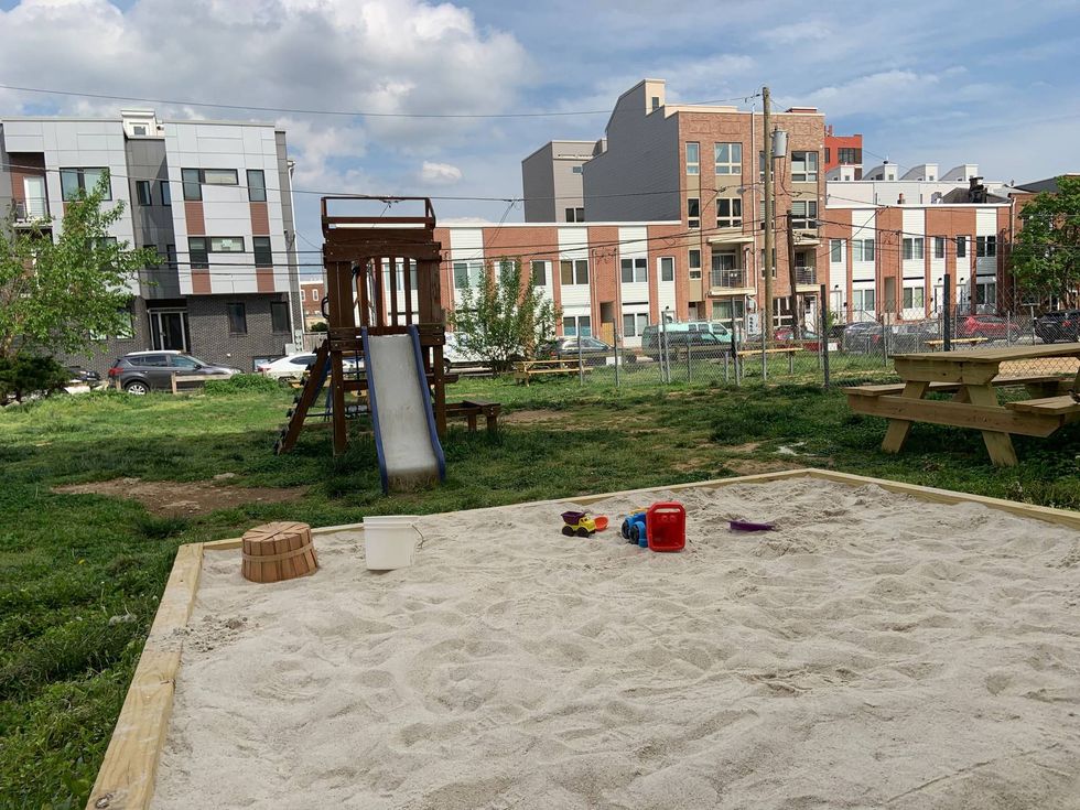 The site, at 15th and Parish streets, has a a picnic table, playground equipment, a sandbox and a fenced-in dog run.