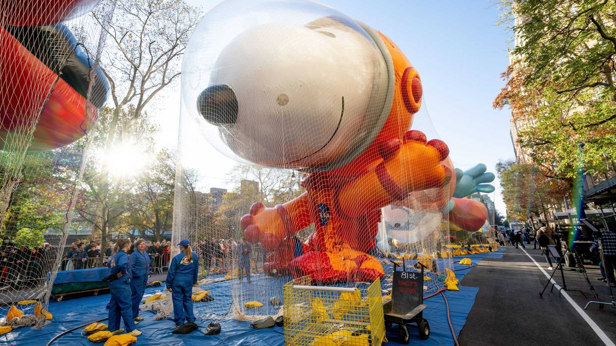The Snoopy in a space suit balloon is being inflated during the 96th Macy's Thanksgiving Day Parade balloon inflation at Central Park on November 23, 2022 in New York City.