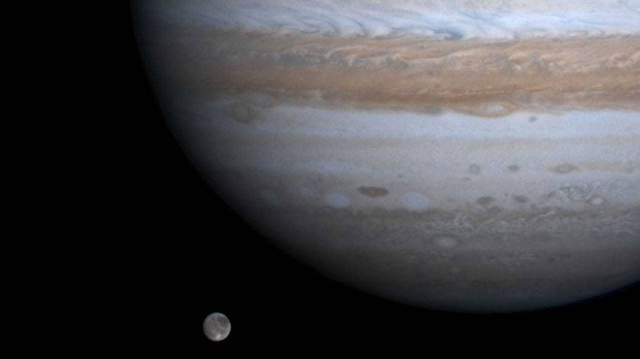 The solar system's largest moon, Ganymede, is captured here alongside the planet Jupiter in this picture taken by NASA's Cassini spacecraft, December 3, 2000.