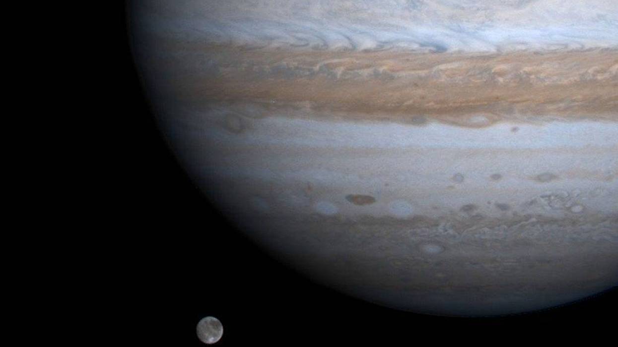 The solar system's largest moon, Ganymede, is captured here alongside the planet Jupiter in this picture taken by NASA's Cassini spacecraft, December 3, 2000.