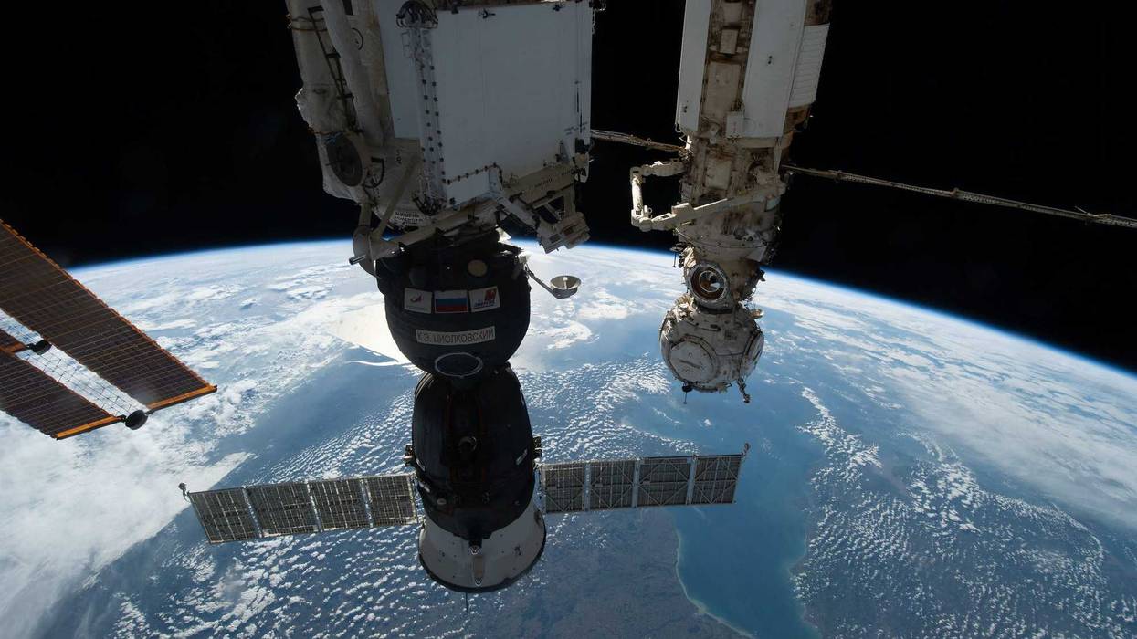 The Soyuz MS-22 crew ship is pictured in the foreground docked to the Rassvet module as the International Space Station orbited 264 miles above Europe. In the background, is the Prichal docking module attached to the Nauka multipurpose laboratory module.