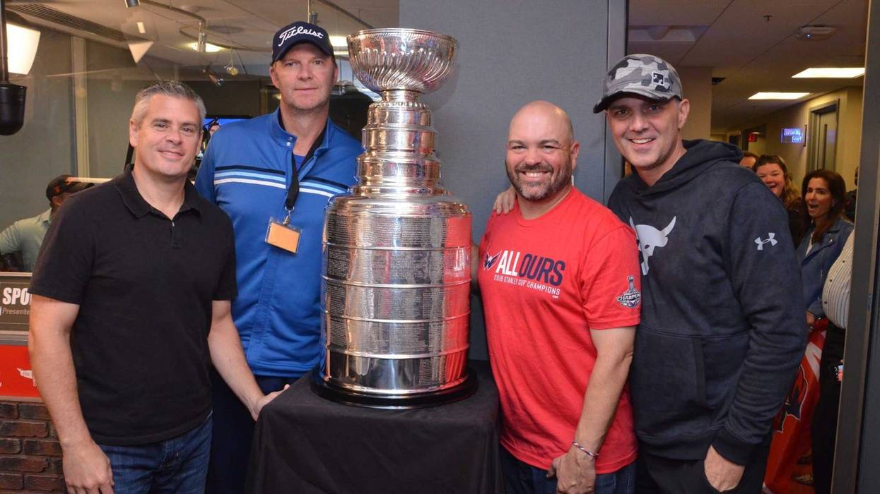 The Sports Junkies pose with The Stanley Cup