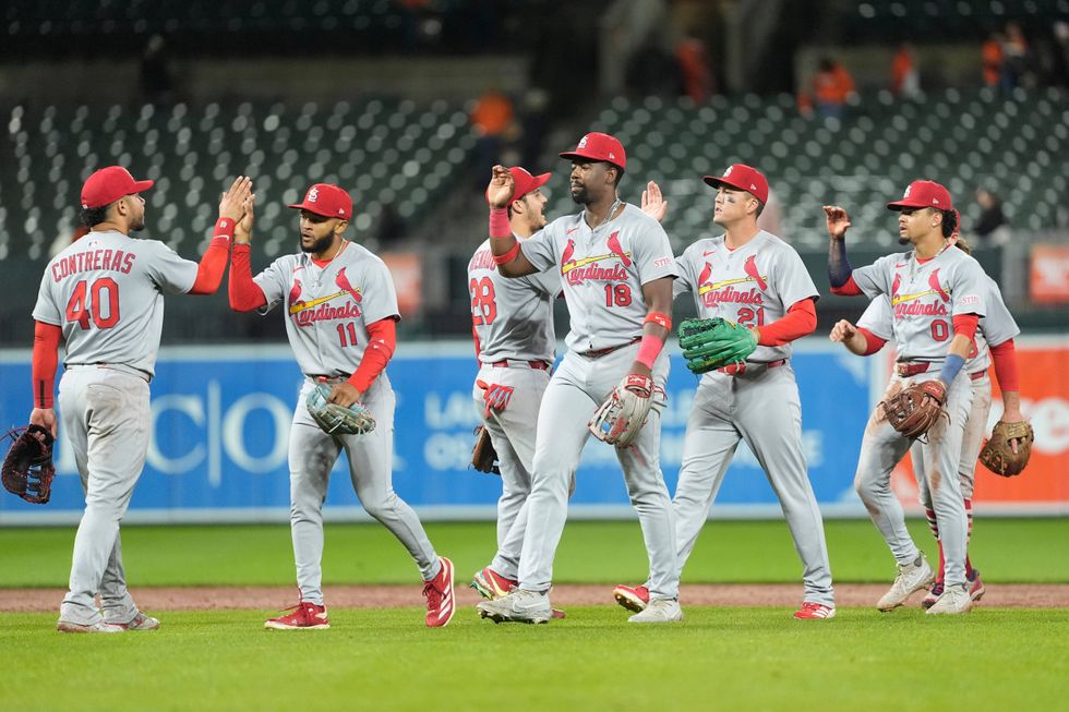 The St. Louis Cardinals celebrate the victory against the Baltimore Orioles after the ninth inning at Oriole Park at Camden Yards.