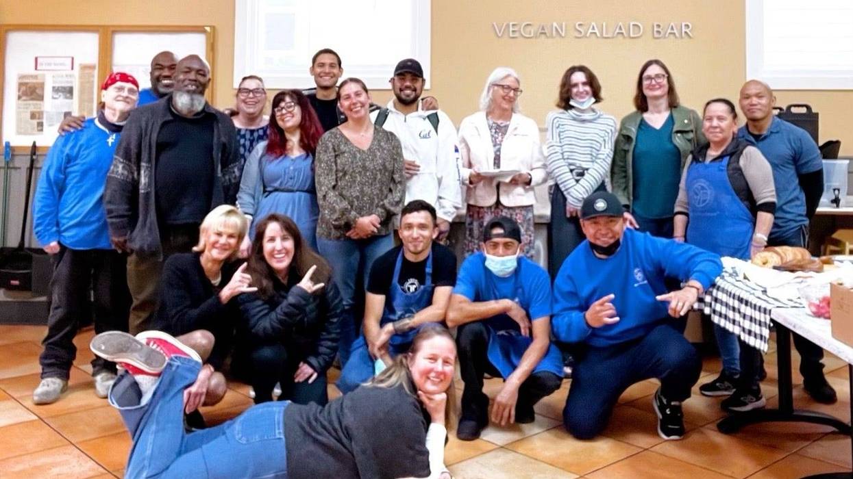 The staff of St. Vincent de Paul Society pose in the dining room.