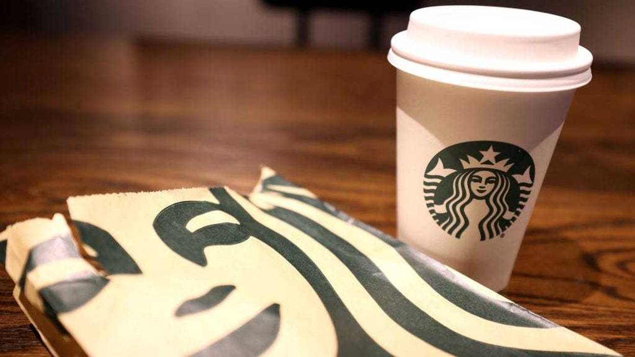The Starbucks logo is display on a cup and bag at a Starbucks store on October 29, 2021 in San Francisco, California.