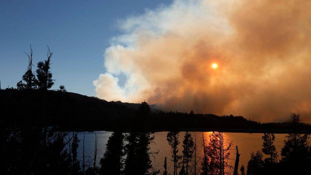 The sun is blocked by smoke from the Caldor Fire as it burns near Caples Lake on August 31, 2021 in Kirkwood, California.