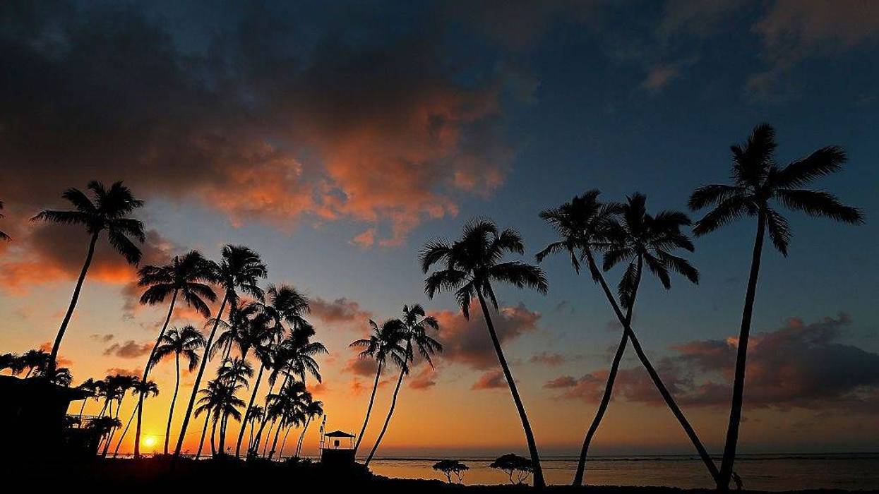The sun rises over the 16th green prior to the final round of the Sony Open at Waialae Country Club on January 18, 2015 in Honolulu, Hawaii.