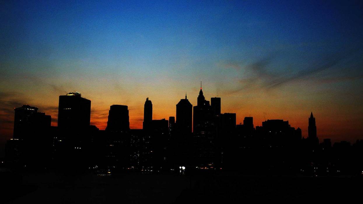 The sun sets over the Manhattan skyline on August 14, 2003, during a major power outage which affected a large part of the northeast U.S. and Canada.