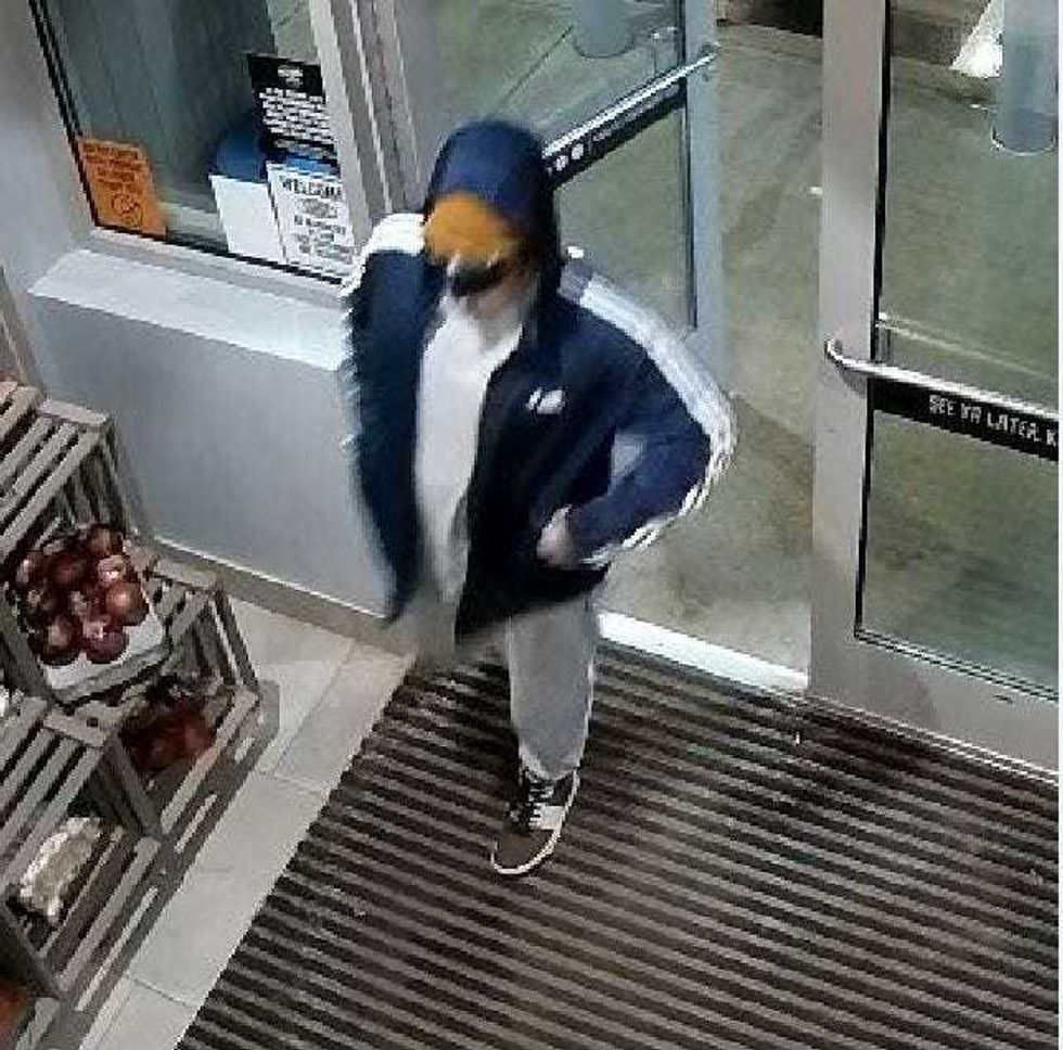 The suspect entering Alltown Fresh.