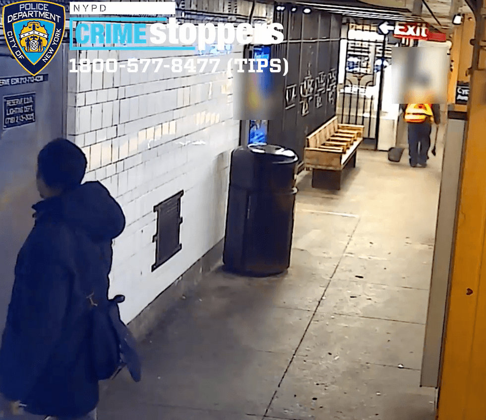 The suspect is seen looking at the worker before the assault
