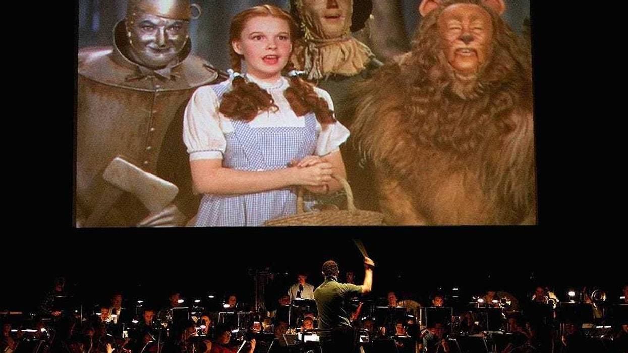 The Sydney Symphony Orchestra during a rehearsal of "The Wizard of Oz" in front of a big screen in the Concert Hall of the Sydney Opera House June 21, 2006 in Sydney, Australia. The classic 1939 "The Wizard of Oz" movie will be shown at Sydney's famous Opera House, with all the original orchestral sound removed and replaced with the musical score played live by the Sydney Symphony. (Photo by Patrick Riviere/Getty Images)