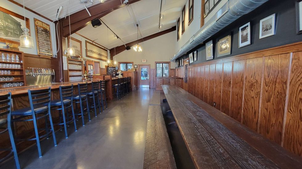 The taproom, closed for two years during the pandemic, has a "warm wood" feel