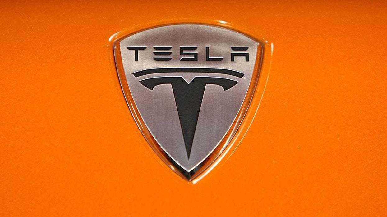 The Tesla Motors is seen on the hood of a Tesla Roadster after a news conference with California governor Arnold Schwarzenegger June 30, 2008 at Tesla Motors in San Carlos, California.