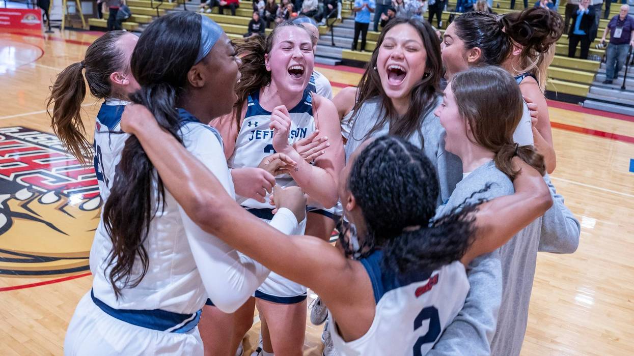 The Thomas Jefferson University women's basketball team celebrates their CACC championship.