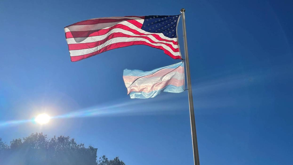 The transgender flag raised by the American flag outside the Bonnell Building at the Community College of Philadelphia during a day remembering transgender victims of violence. Five people were killed and dozens were wounded in a mass shooting at a gay club in Colorado Springs.