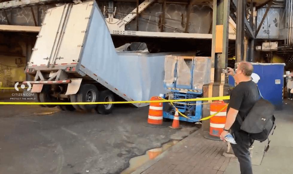 The truck was left mangled, but no injuries were reported