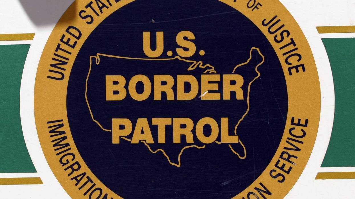 The U.S. Border Patrol emblem is seen on the side of an agent's truck patrolling the border May 14, 2006 in Nogales, Arizona.