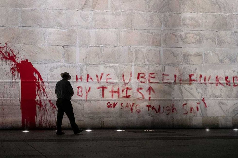 The U.S. Park Police guard the Washington Monument after a vandal wrote graffiti and threw red paint against the base of the structure on September 21, 2022 in Washington, DC.