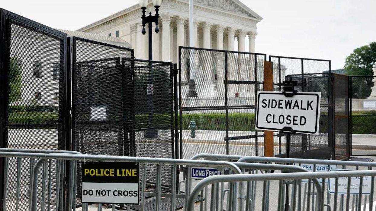 The U.S. Supreme Court building continues to be surrounded by a temporary security fence on June 22, 2022 in Washington, DC. The Court is due to hand down opinions in several important cases, including Dobbs v. Jackson Women’s Health Organization, which could overturn the 50-year-old federal right to abortion.