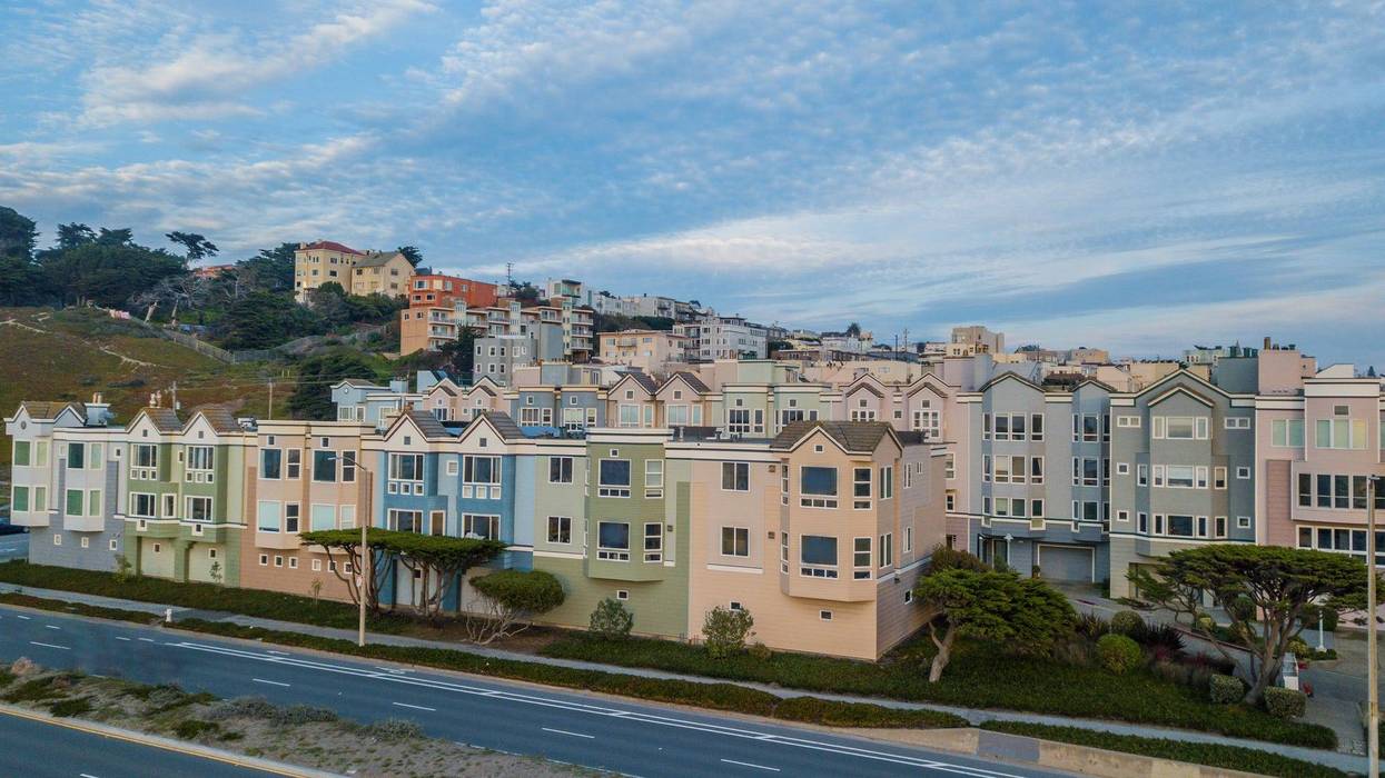 The uniformity of windows on row houses in San Francisco's Ocean Beach.