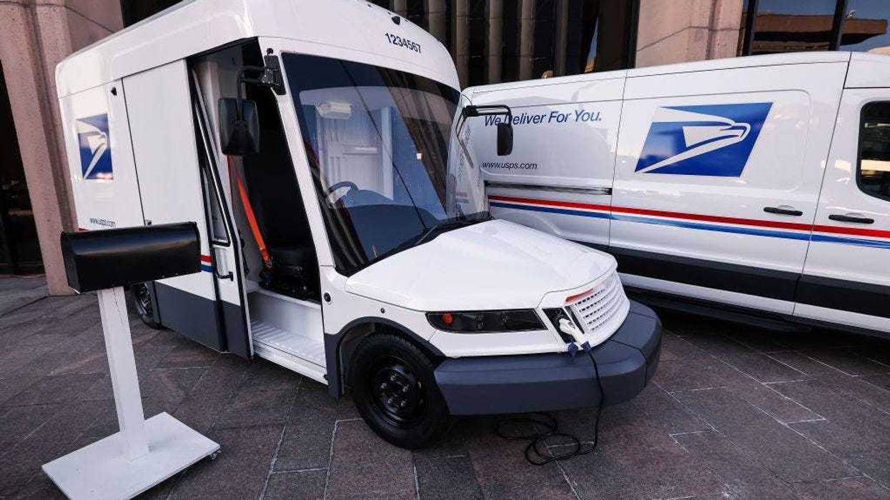 The United States Postal Service unveils two of its battery-powered vehicles at an event announcing its plan on implementing electric vehicles, at the Postal Service Headquarters on December 20, 2022 in Washington, DC.