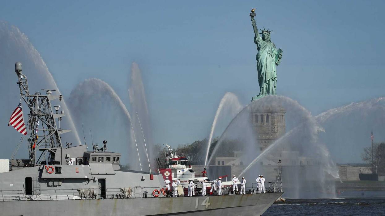 The USS Tornado sails past the Statue of Liberty during the Fleet Week Parade of Ships in New York Harbor, May 22, 2019 in New York City