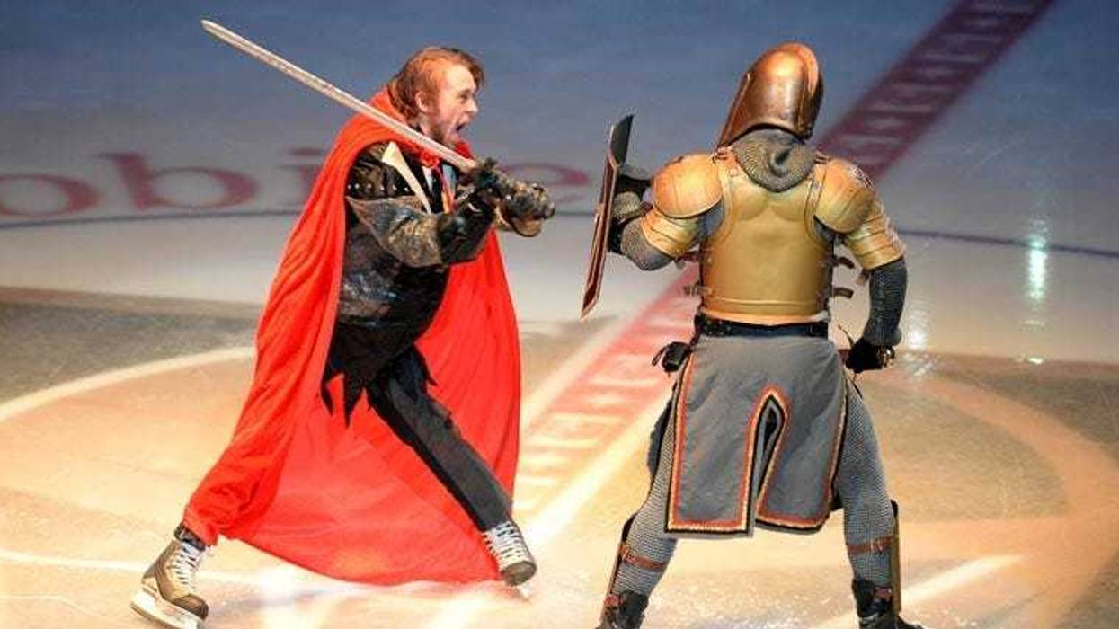 The Vegas Golden Knights' mascot duels the Washington Capitals' mascot before Game 1 of the 2018 Stanley Cup Final on May 28, 2018, at T-Mobile Arena in Las Vegas.