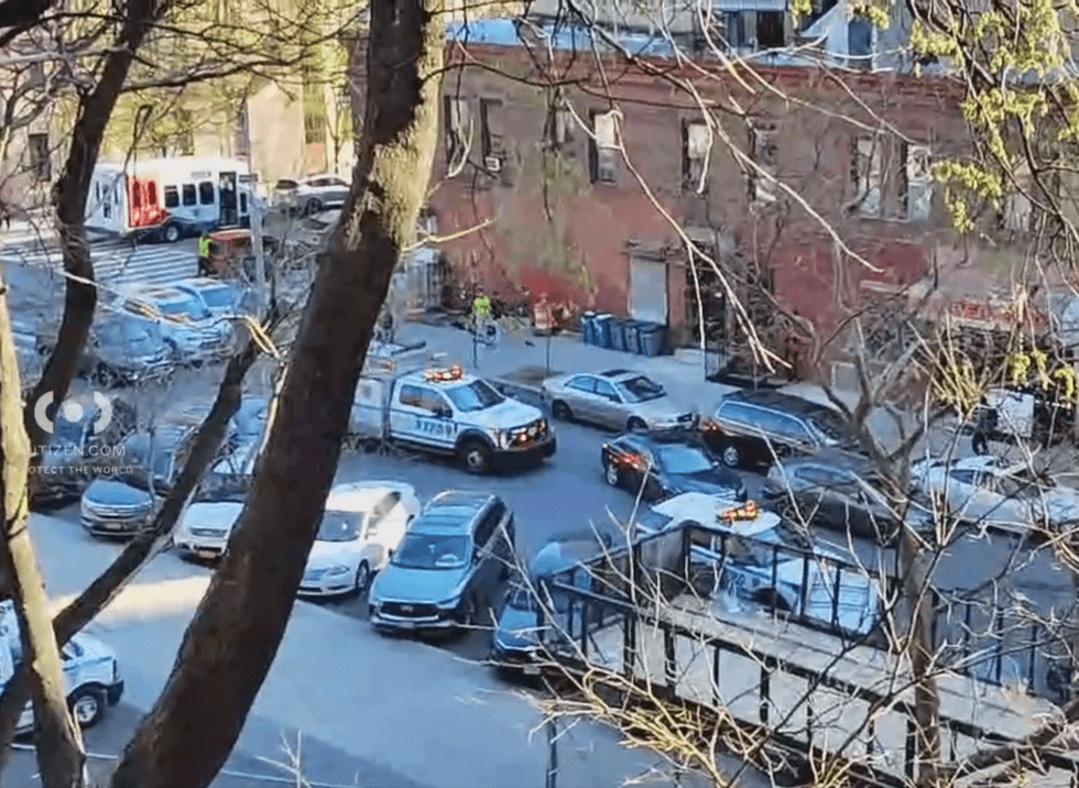 The victim was shot in the chest in broad daylight inside the lobby, police said
