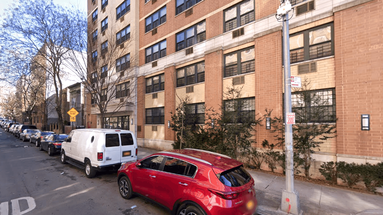 The victim was stabbed in the head in an elevator at her building on Morris Avenue in Fordham Heights