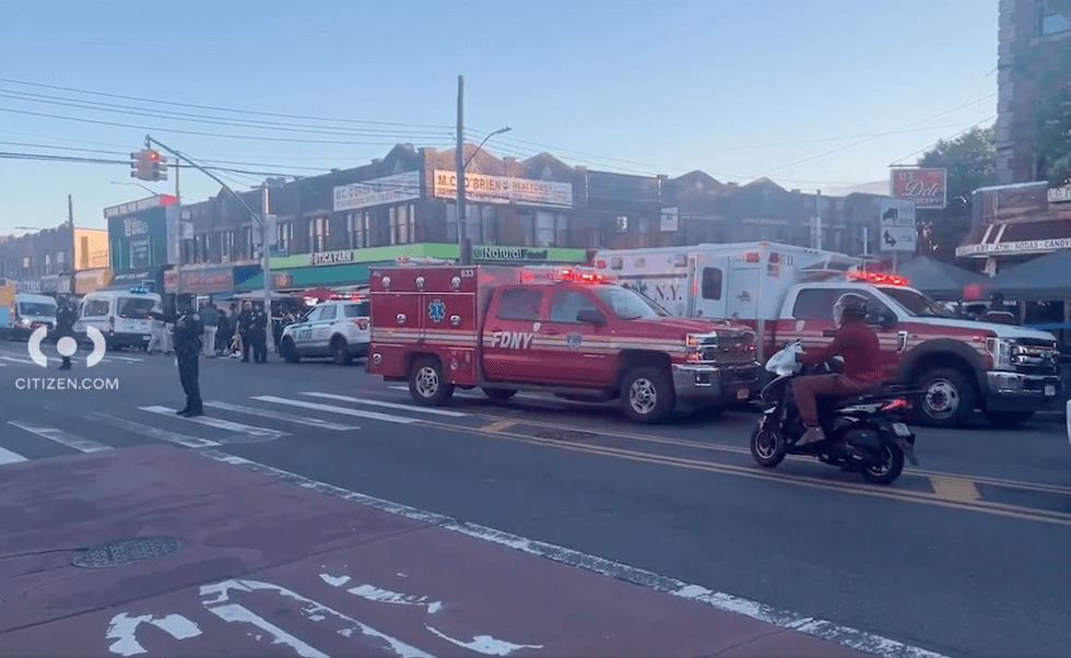 The victim was waiting at a bus stop when shots rang out and she was hit in the leg, police said
