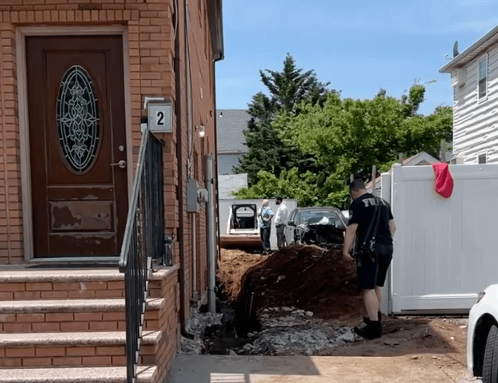 The wall collapsed on 150th Street in South Jamaica, Queens, on Monday