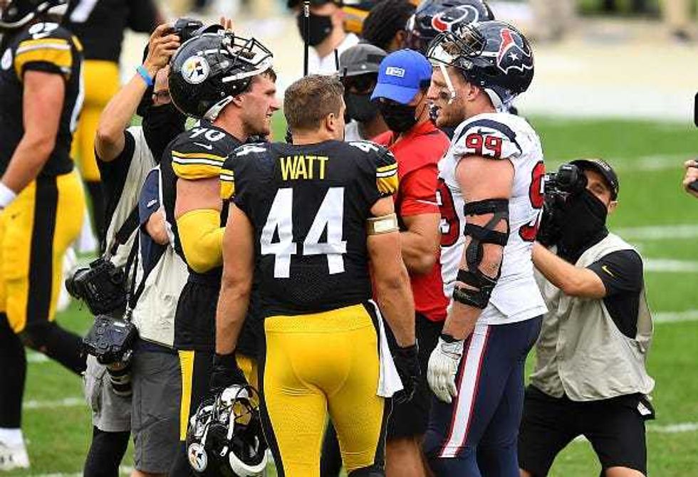 The Watt brothers chat after a Steelers-Texans game.