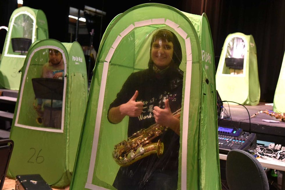 The Wenatchee High School band plays in so-called "pop-up music pods," a safe way for the students to practice indoors.