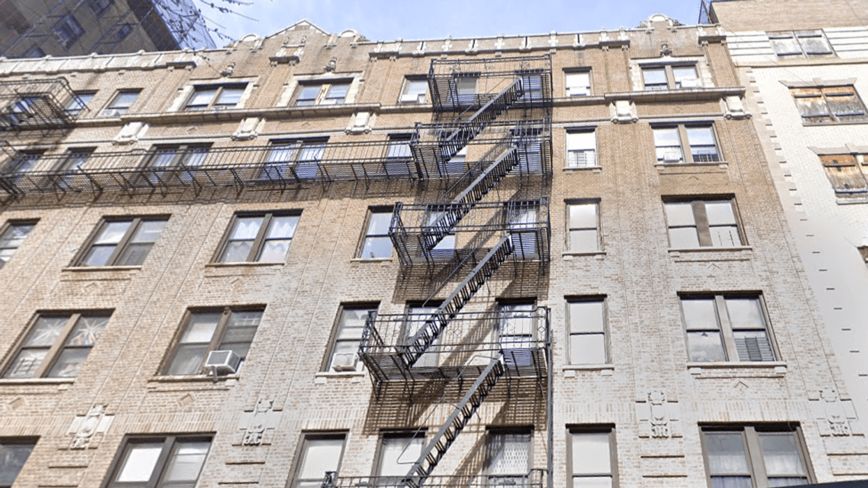 The West Harlem building where a fire injured nine people early Saturday morning.