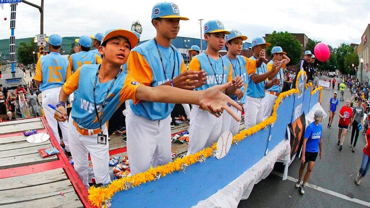 The West Region champion Little League team from Honolulu rides in the Little League Grand Slam Parade in downtown Williamsport, Pa., Monday, Aug. 15, 2022. The Little League World Series baseball tournament, featuring 20 teams from around the world, starts on Wednesday in South Williamsport, Pa.