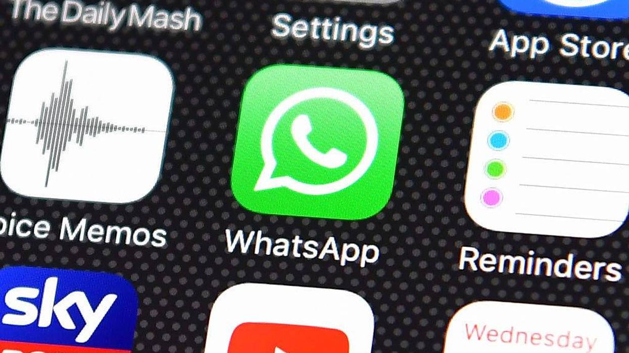 The Whatsapp app logo is displayed on an iPhone on August 3, 2016 in London, England.