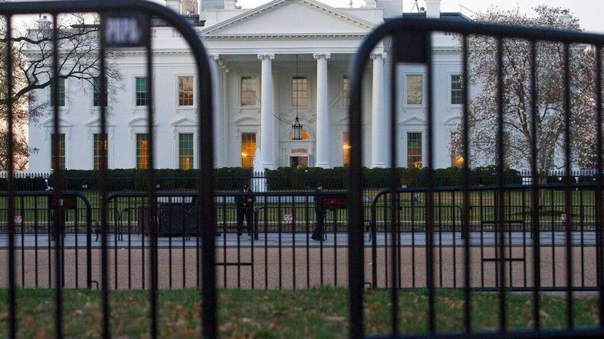 The White House is seen behind security barriers in Washington